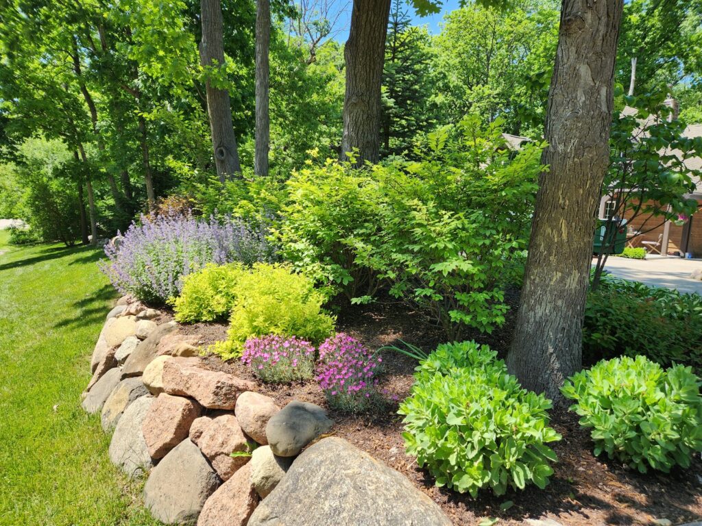Boulder wall with perennial planting bed
