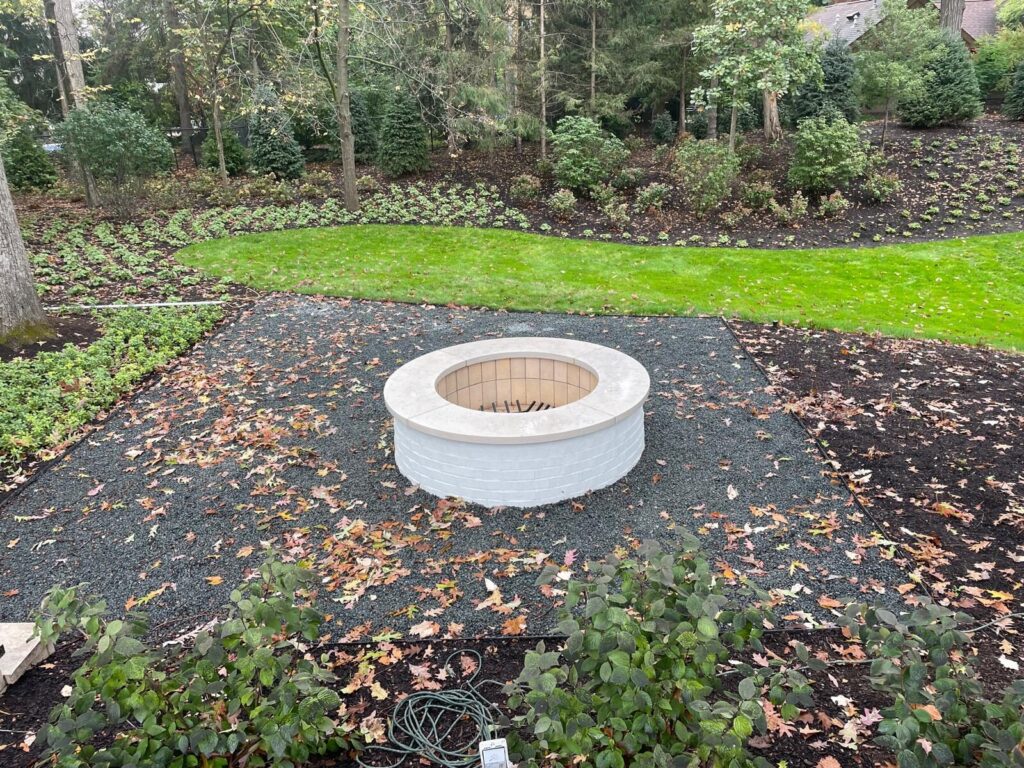 Stone Fire Pit Round stone fire pit with new landscaping